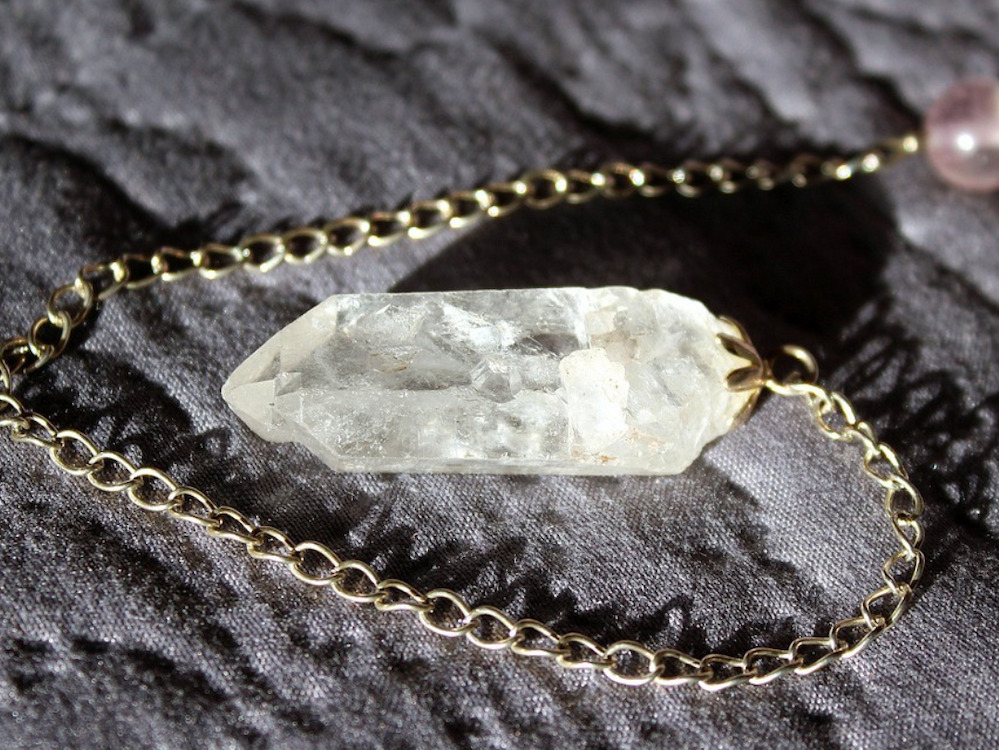 Clear quartz pendulum on a silver chain